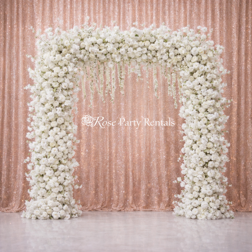 White rose arch on rose gold sequin with wisteria